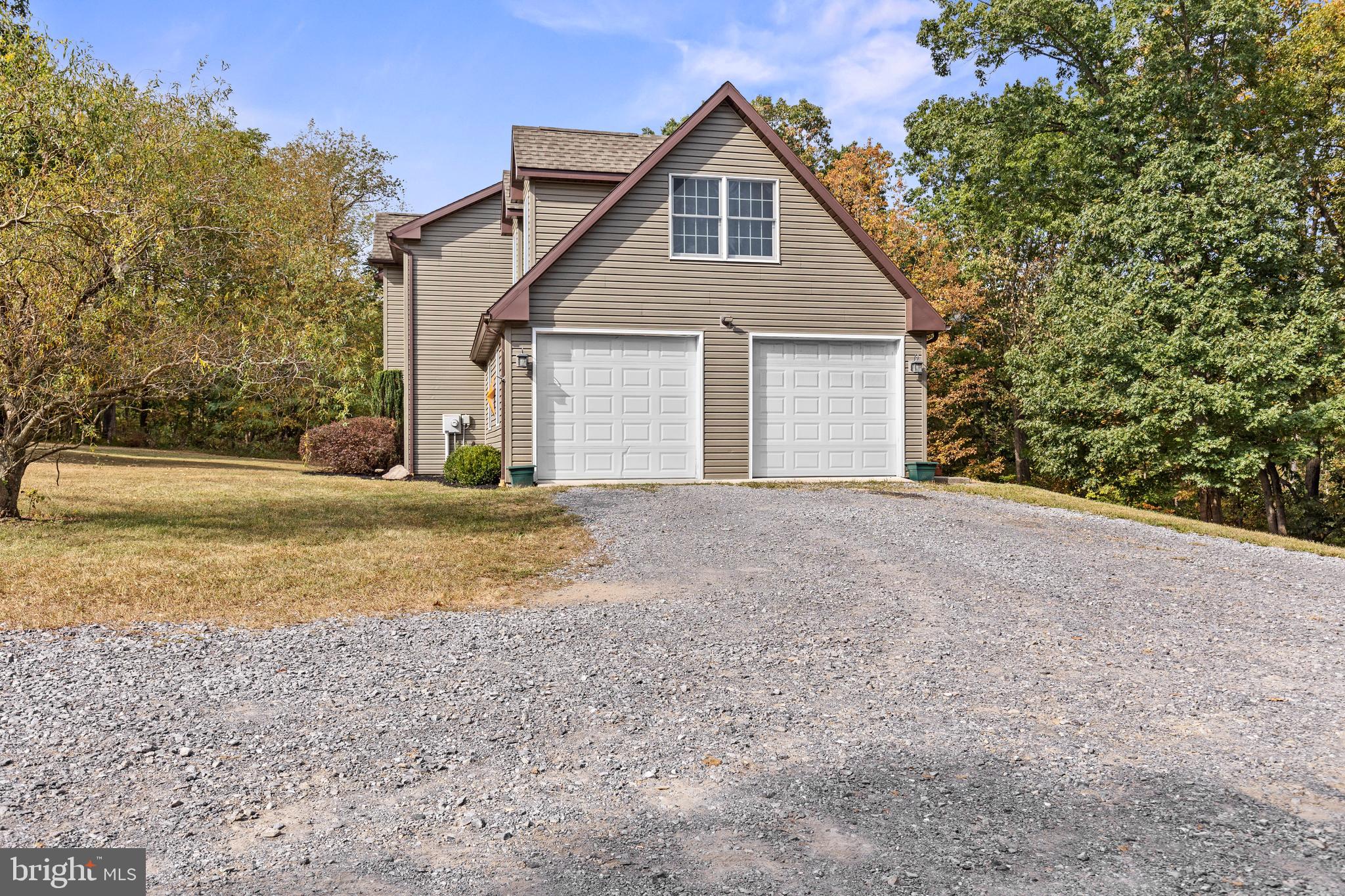 14731 Shimpstown Road Mercersburg, PA 17236 - Photo 8 of 52 a view of a house with a yard and garage