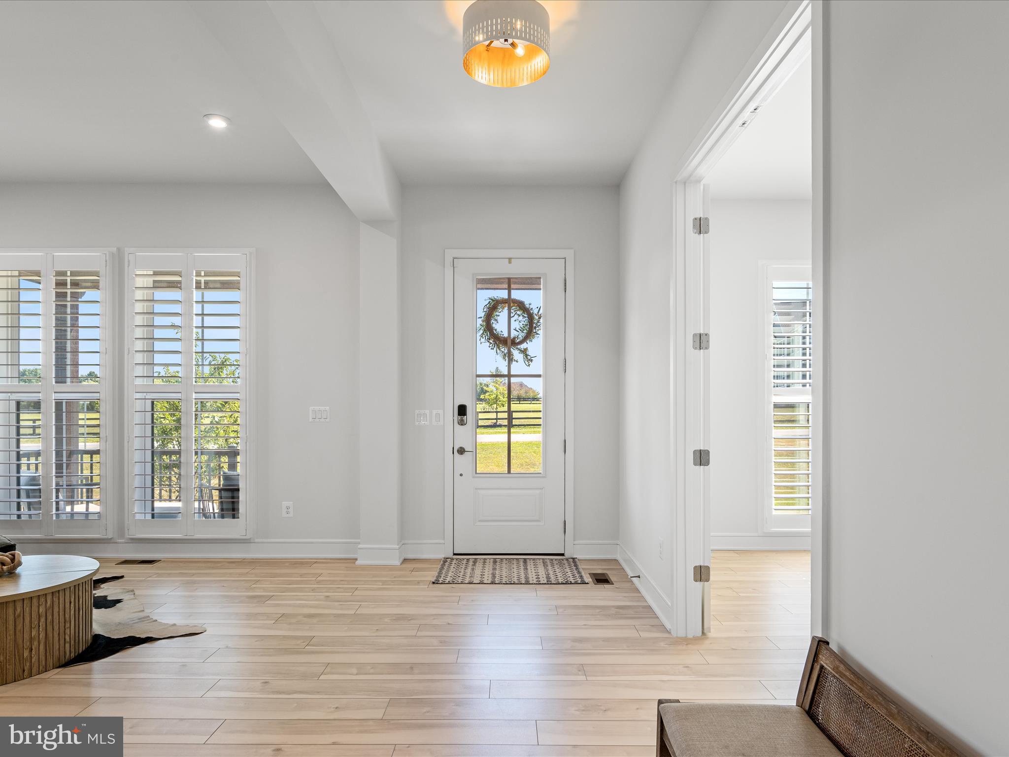 38906 Rumely Way Waterford, VA 20197 - Photo 11 of 99 a view of an empty room with window and wooden floor