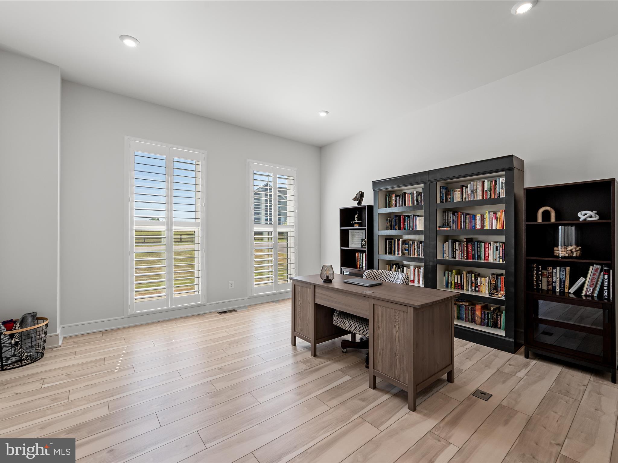 38906 Rumely Way Waterford, VA 20197 - Photo 18 of 99 a view of a workspace with furniture and wooden floor