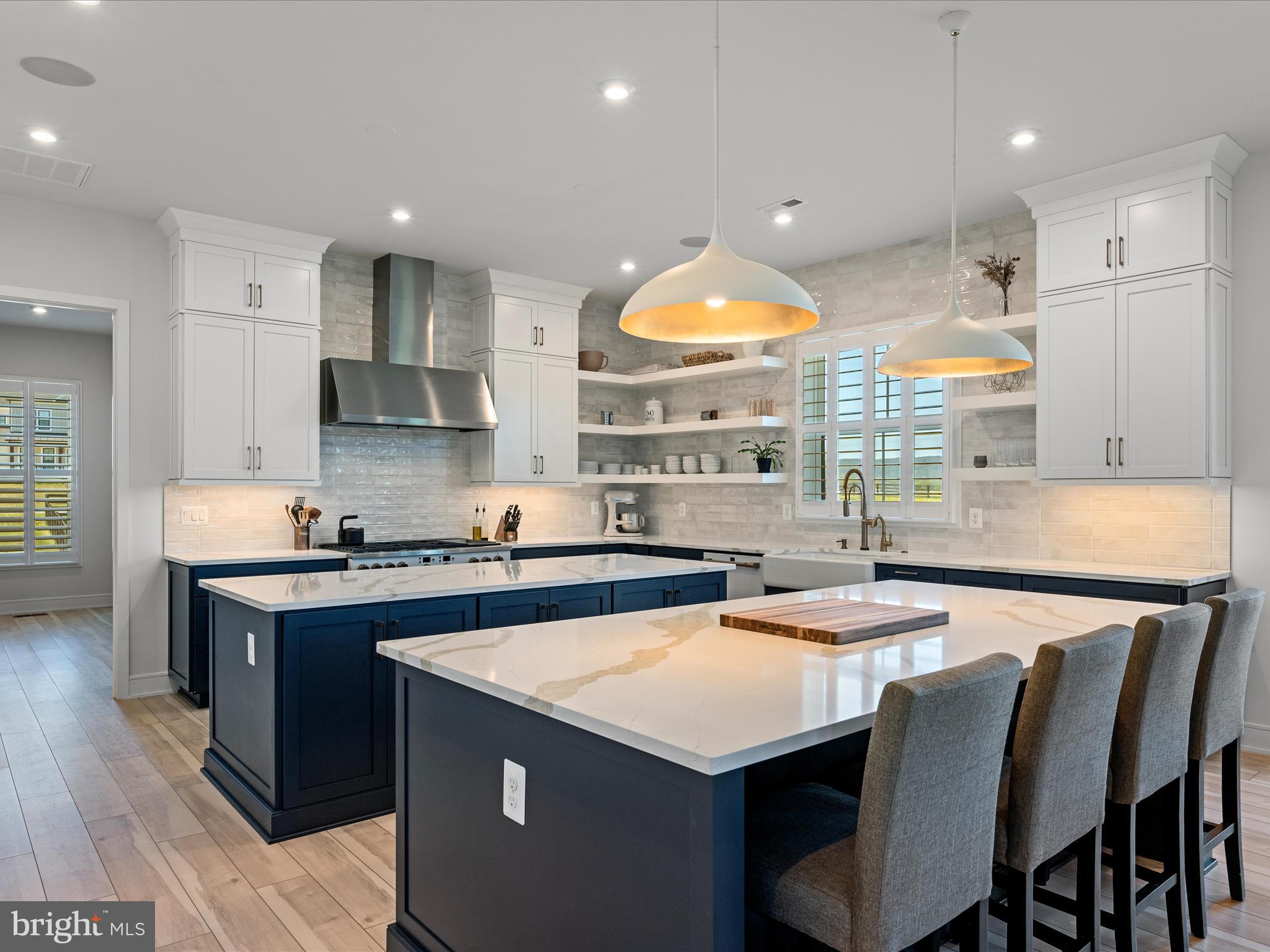 38906 Rumely Way Waterford, VA 20197 - Photo 29 of 99 a kitchen with stainless steel appliances granite countertop a stove a sink a refrigerator and a microwave