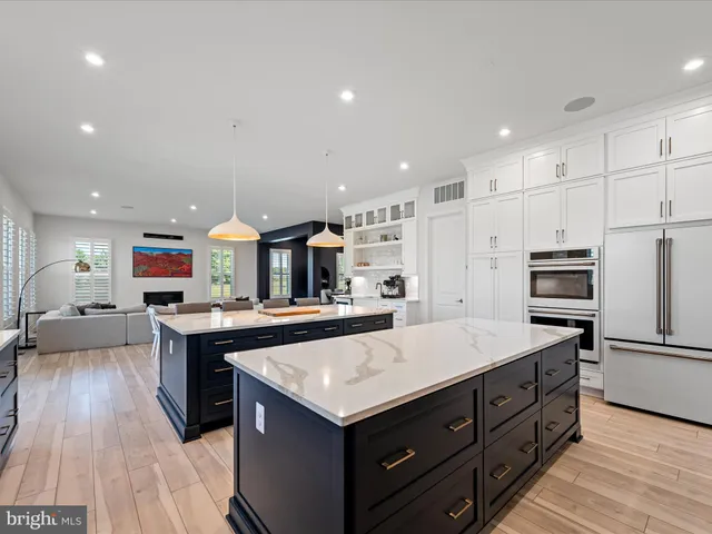 a utility room with sink dryer and washer