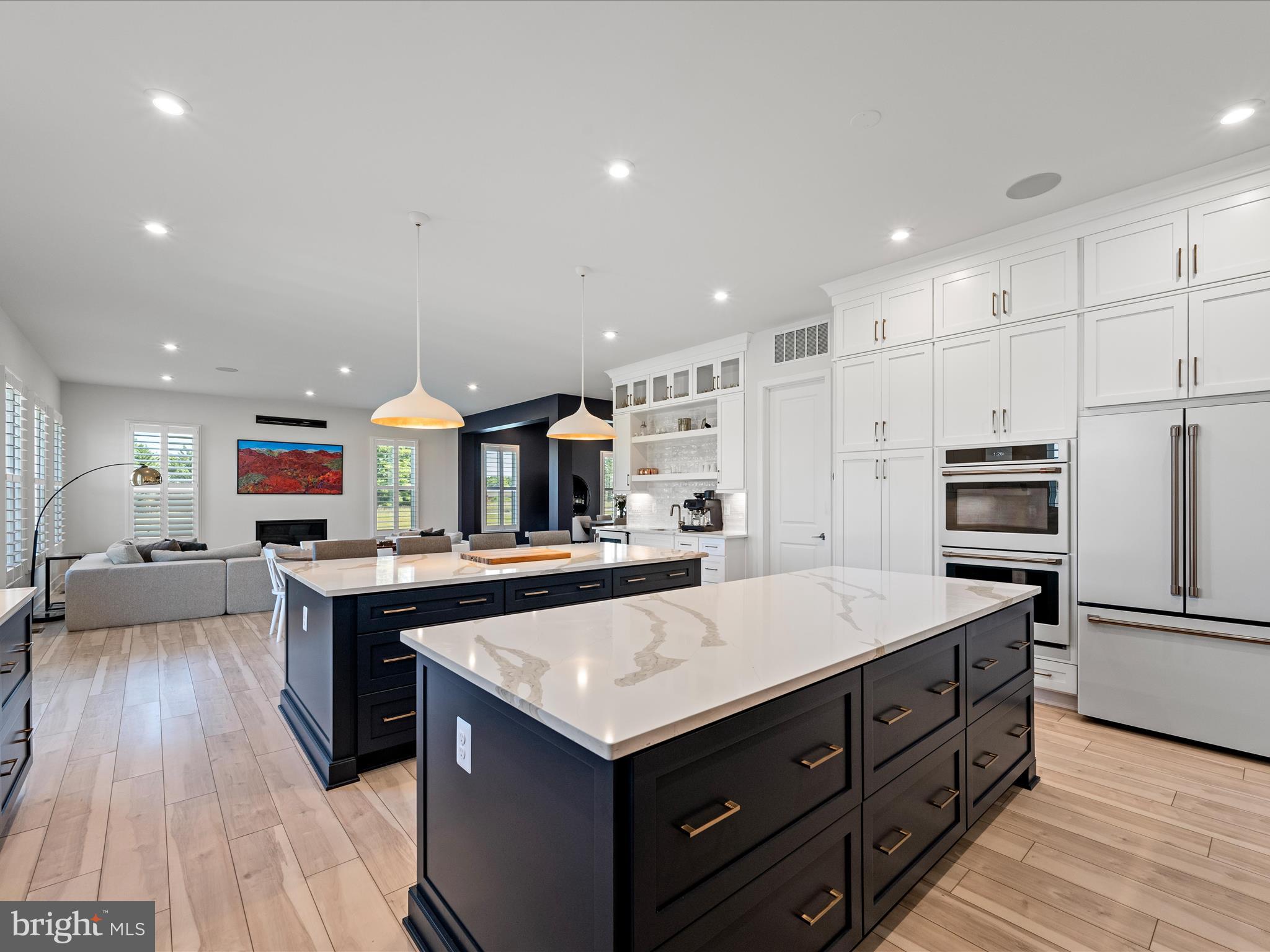 38906 Rumely Way Waterford, VA 20197 - Photo 34 of 99 a kitchen with stainless steel appliances granite countertop a stove and a refrigerator