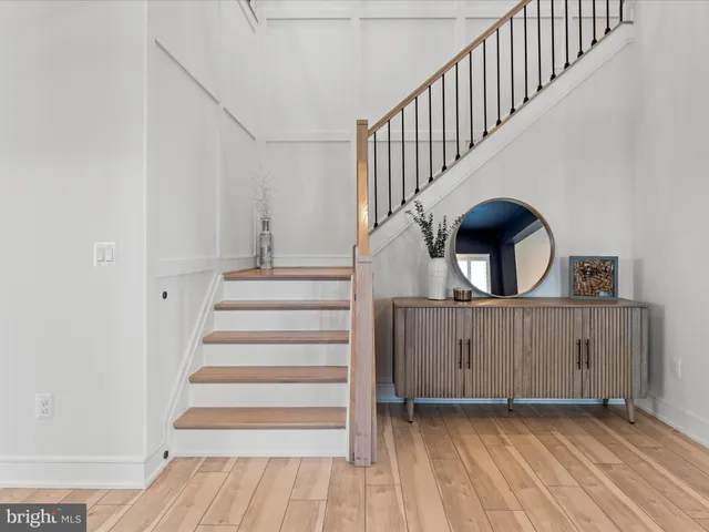a bathroom with a double vanity sink toilet mirror and shower