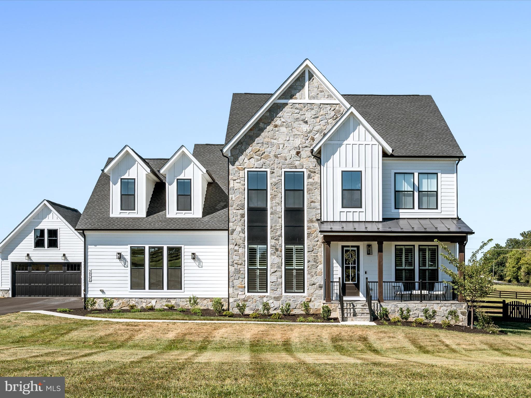 38906 Rumely Way Waterford, VA 20197 - Photo 5 of 99 a front view of a house with a yard