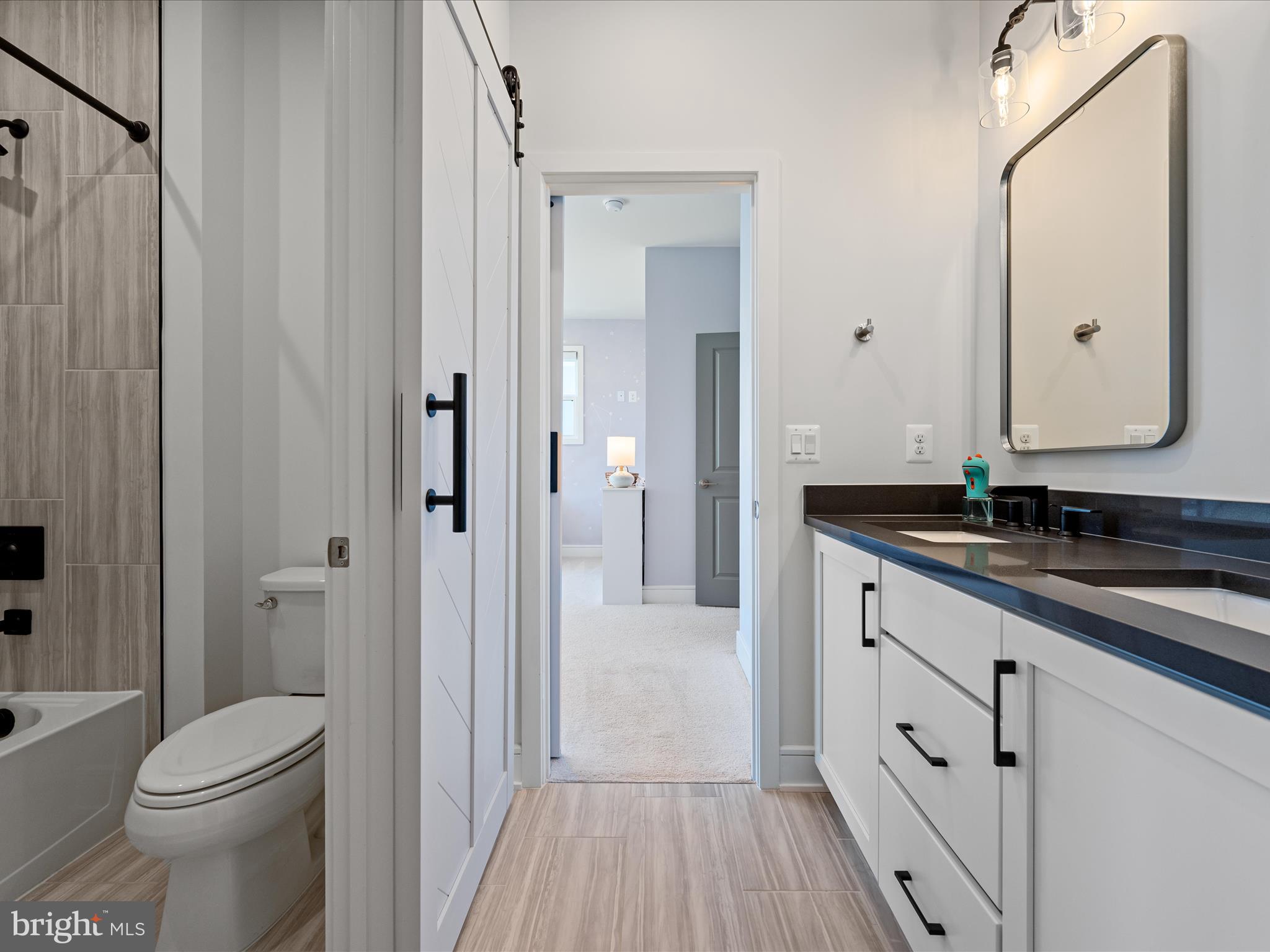 38906 Rumely Way Waterford, VA 20197 - Photo 56 of 99 a bathroom with a granite countertop sink toilet and shower