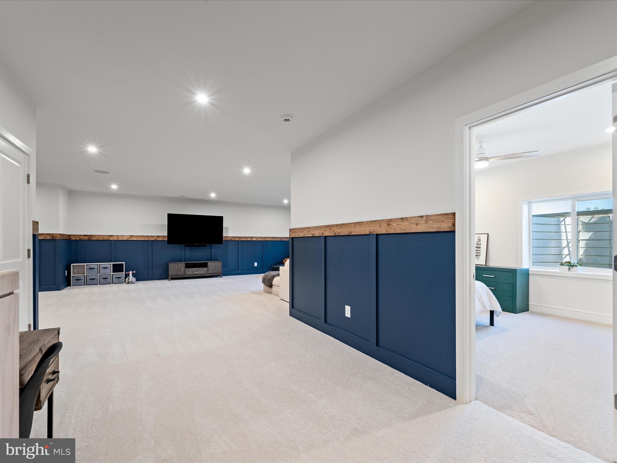 38906 Rumely Way Waterford, VA 20197 - Photo 68 of 99 a large bedroom with a large bed and a flat tv screen on dresser