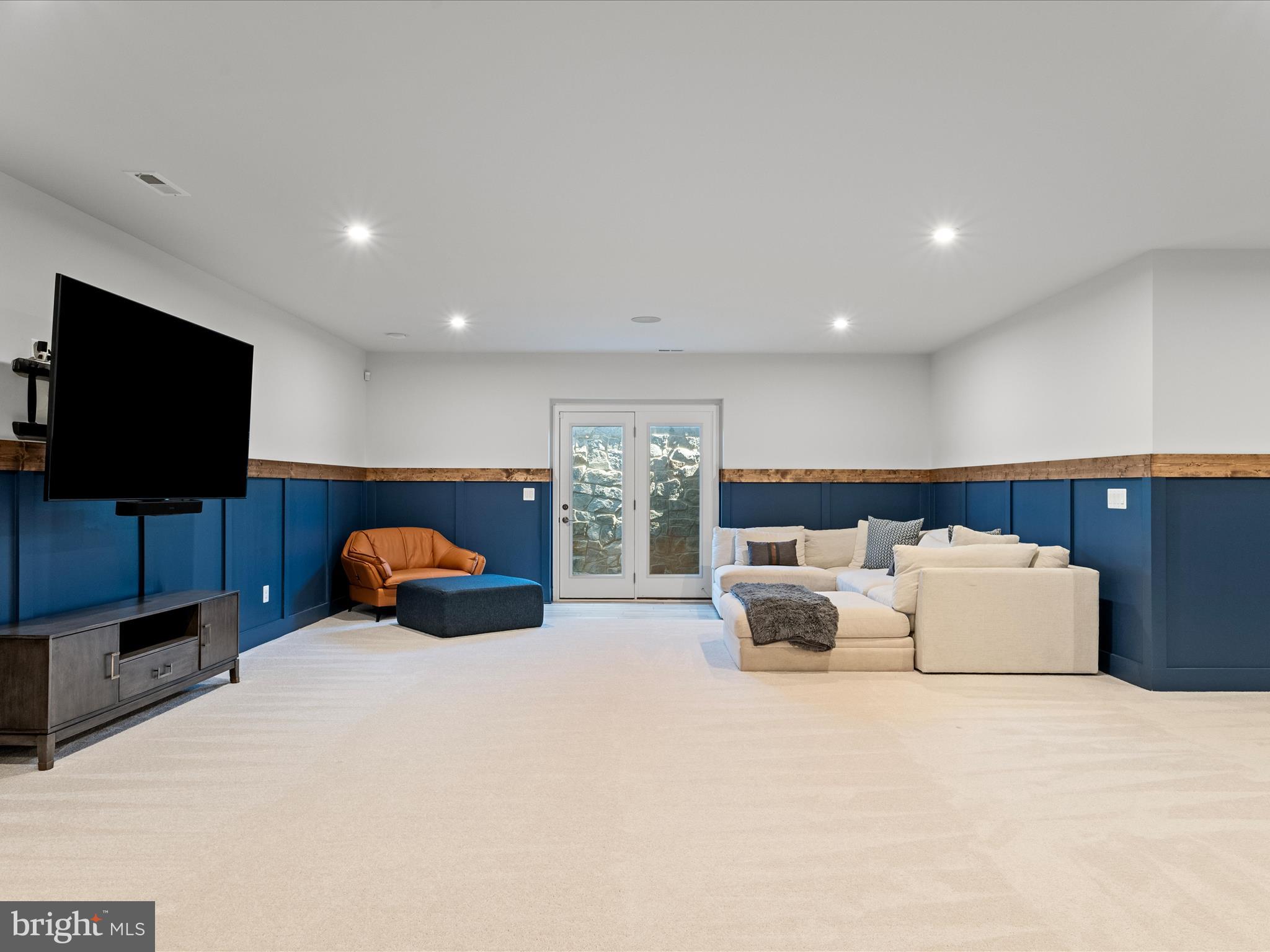 38906 Rumely Way Waterford, VA 20197 - Photo 69 of 99 a living room with furniture and a flat screen tv