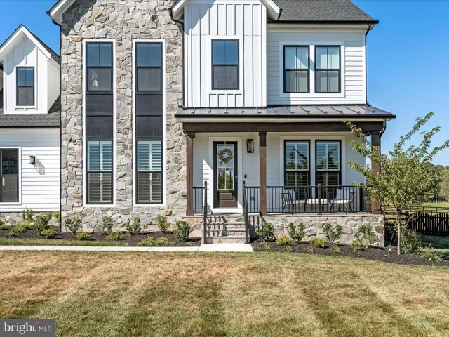 a view of living room with furniture and wooden floor