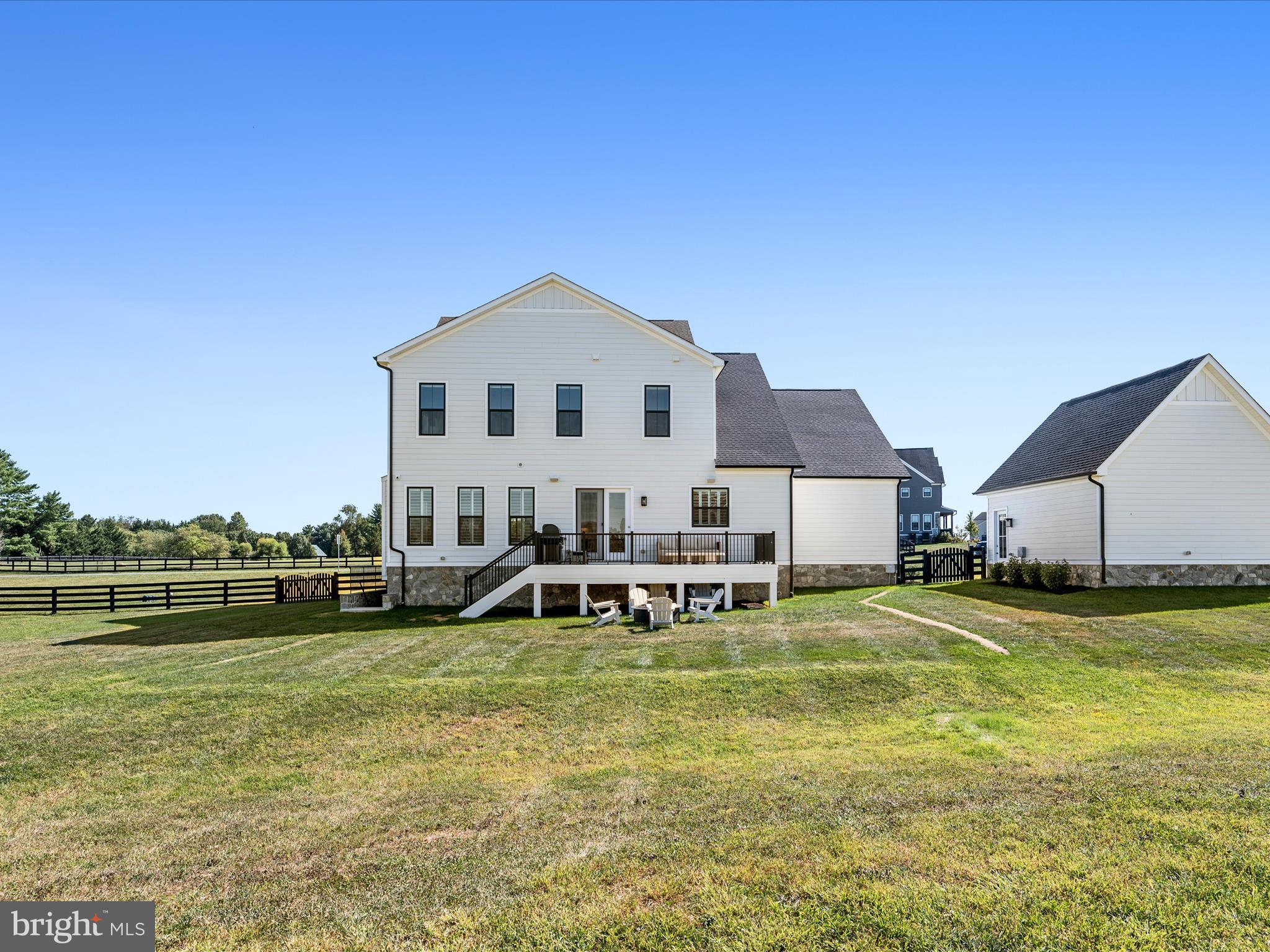 38906 Rumely Way Waterford, VA 20197 - Photo 83 of 99 a view of a house with a big yard and sitting area