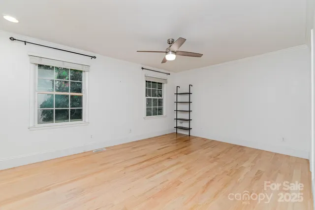 a view of empty room with windows