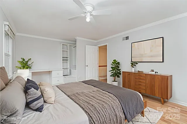 a bedroom with a bed dresser and a window