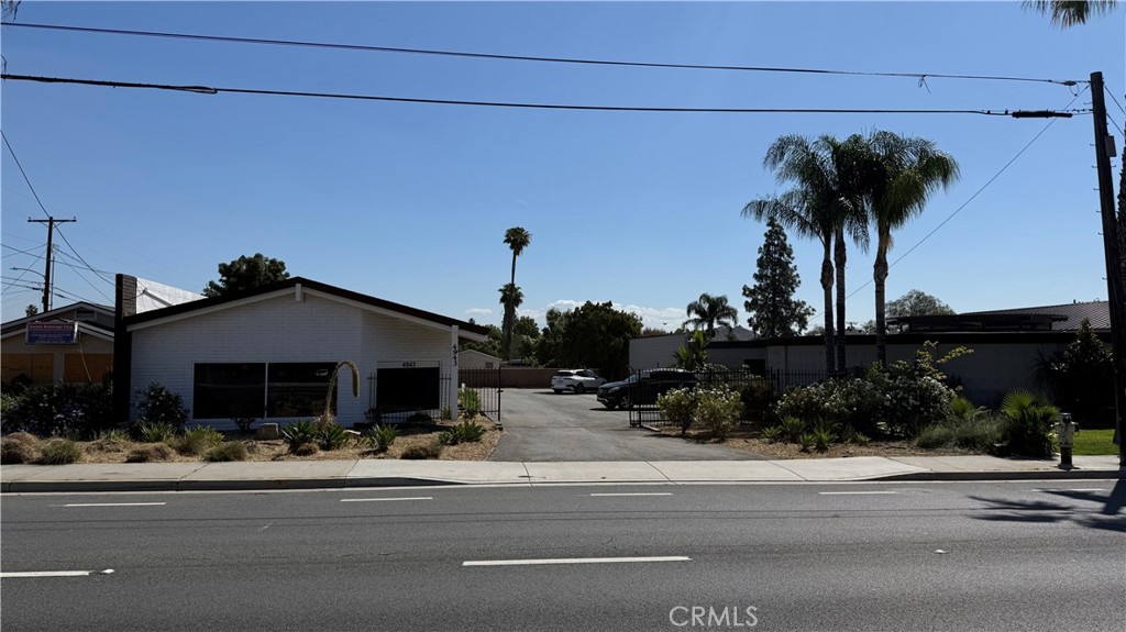 4943 La Sierra Avenue Riverside, CA 92505 - Photo 1 of 16 a front view of a house with a yard and potted plants