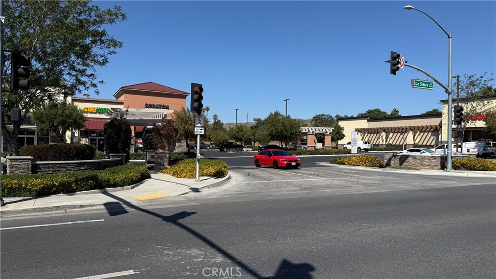 4943 La Sierra Avenue Riverside, CA 92505 - Photo 14 of 16 a view of a street with cars parked on the road