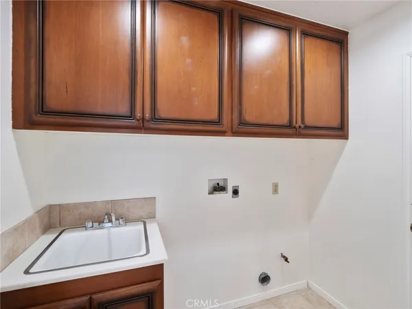 an empty room with a ceiling fan and window