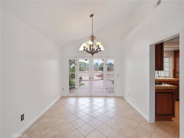 a kitchen with stainless steel appliances granite countertop a refrigerator sink and cabinets