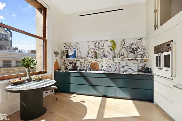a view of living room with furniture and garden view