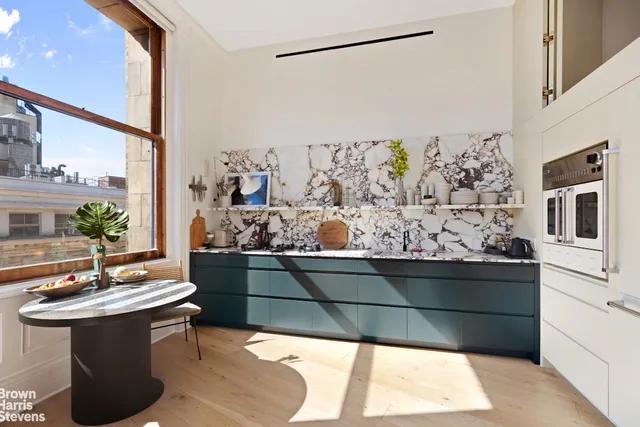 a view of living room with furniture and garden view