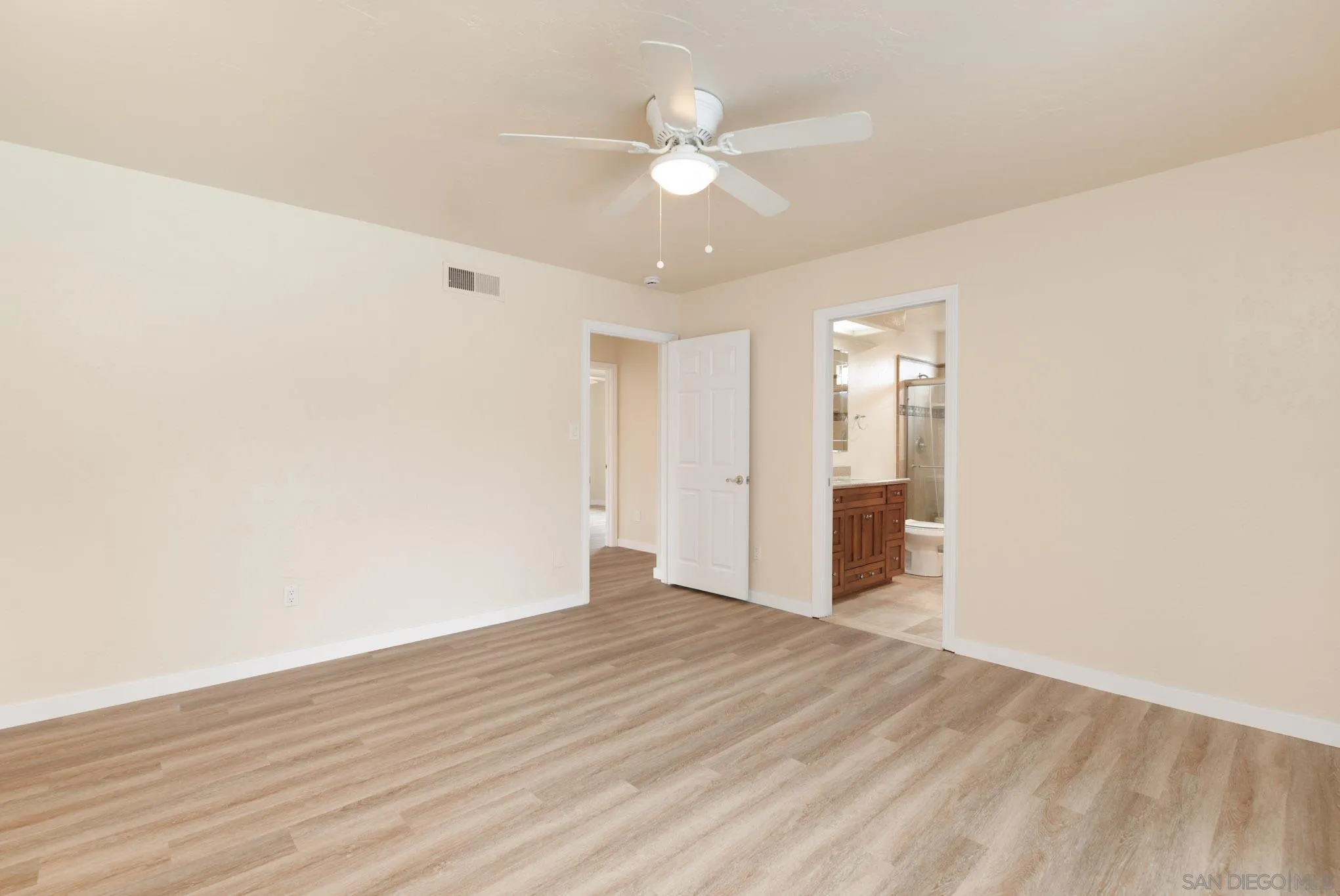 1961 Pine View Road Alpine, CA 91901 - Photo 14 of 35 an empty room with wooden floor and ceiling fan