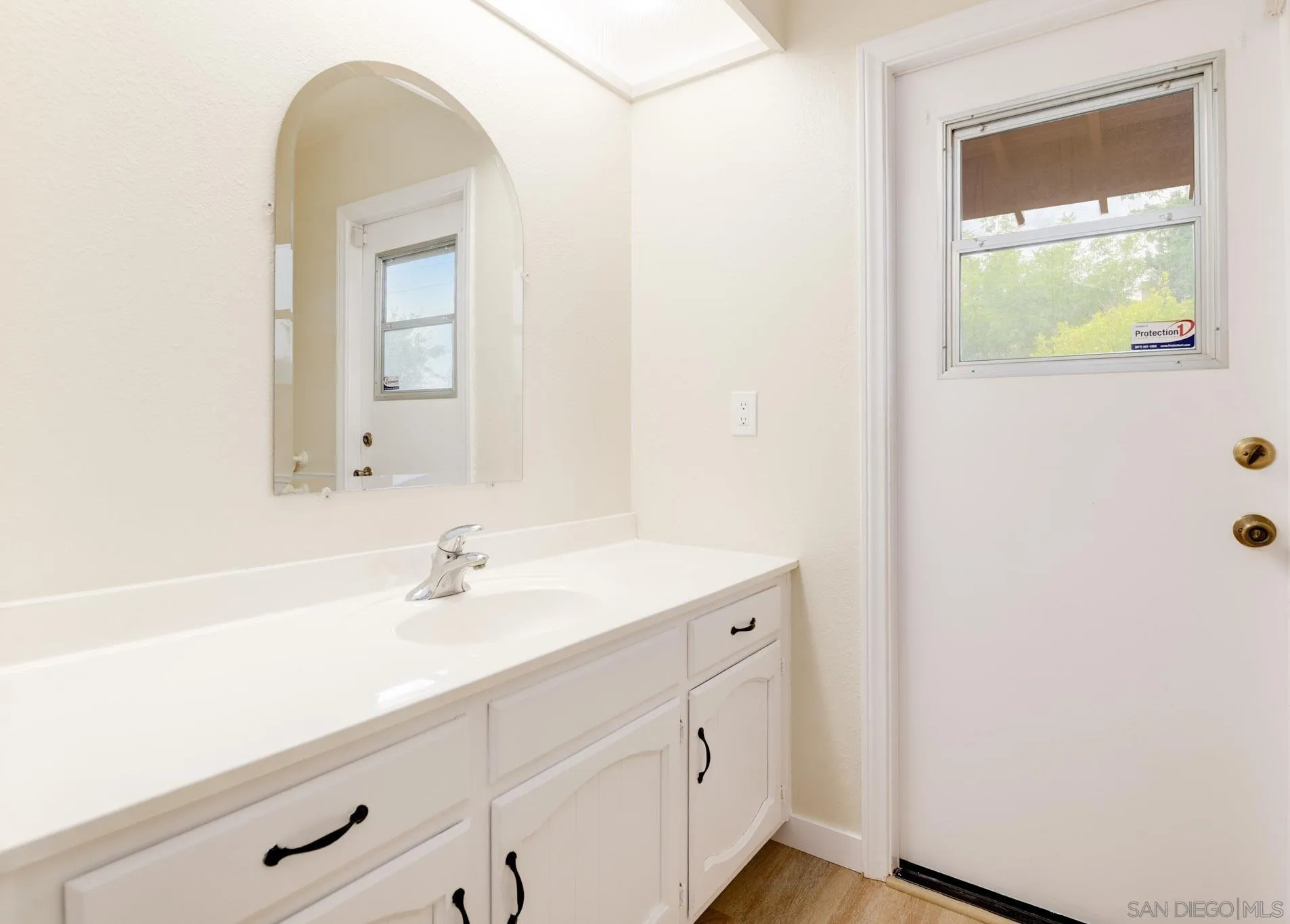 1961 Pine View Road Alpine, CA 91901 - Photo 20 of 35 a bathroom with a sink and a mirror