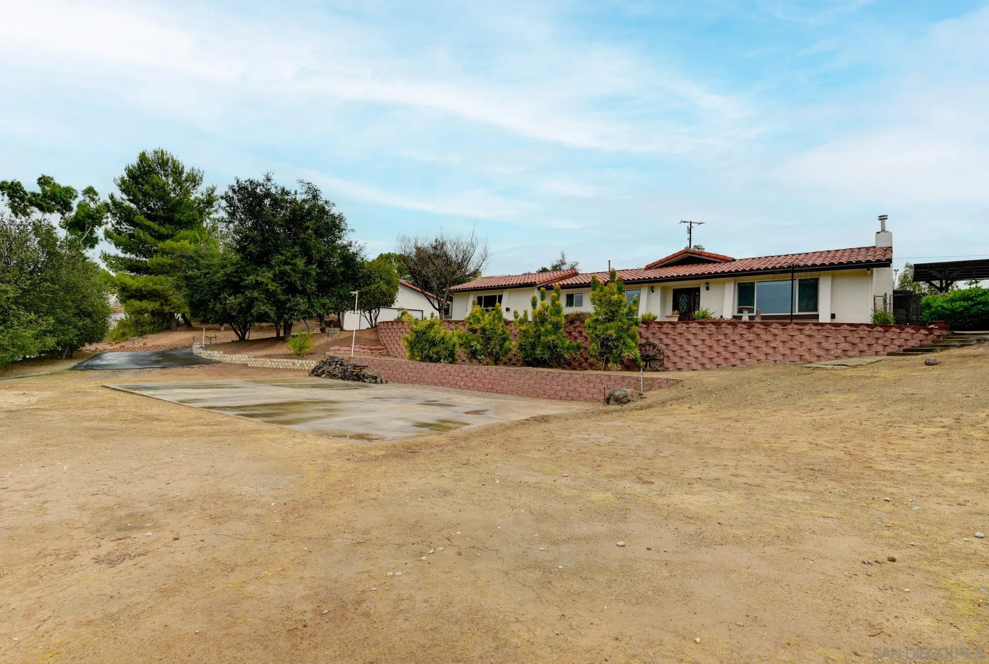 1961 Pine View Road Alpine, CA 91901 - Photo 28 of 35 a view of swimming pool with outdoor seating and trees in the background