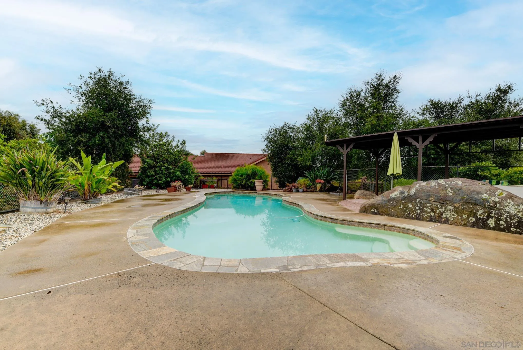 1961 Pine View Road Alpine, CA 91901 - Photo 10 of 35 a swimming pool with outdoor seating and garden