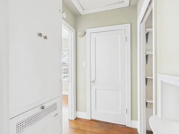 a view of bedroom with wooden floor