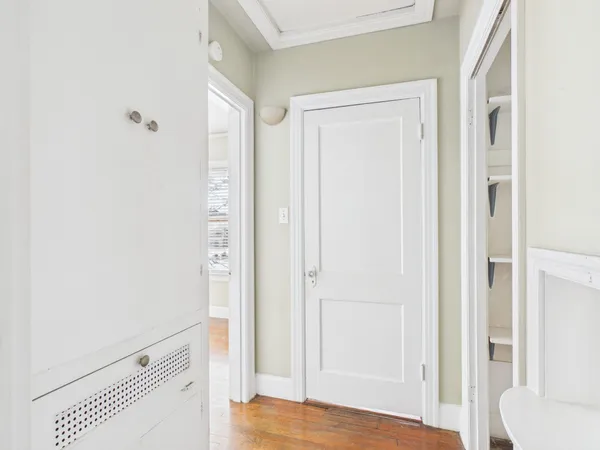 a view of bedroom with wooden floor