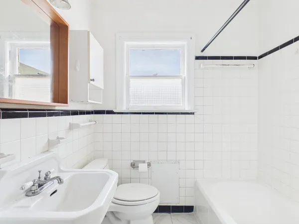 a bathroom with a sink a toilet and a bathtub