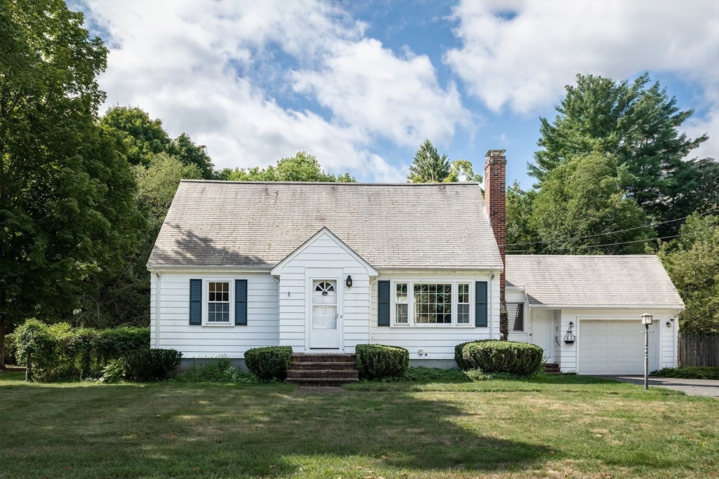 a view of house with yard