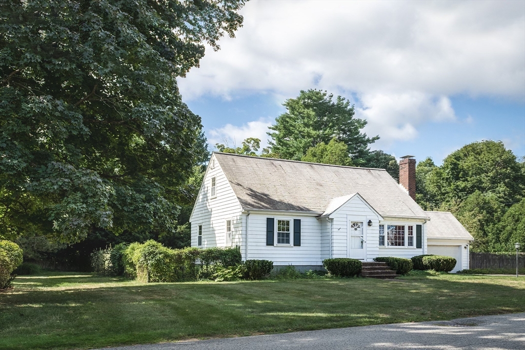21 Ortins Road Hamilton, MA 01982 - Photo 2 of 16 front view of a house and a yard