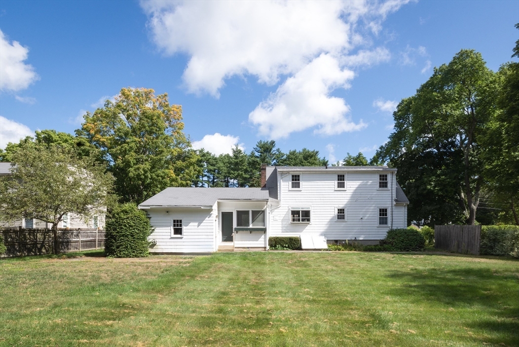 21 Ortins Road Hamilton, MA 01982 - Photo 3 of 16 a view of a white house with a big yard and large trees