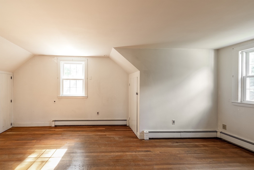 21 Ortins Road Hamilton, MA 01982 - Photo 9 of 16 an empty room with wooden floor and windows