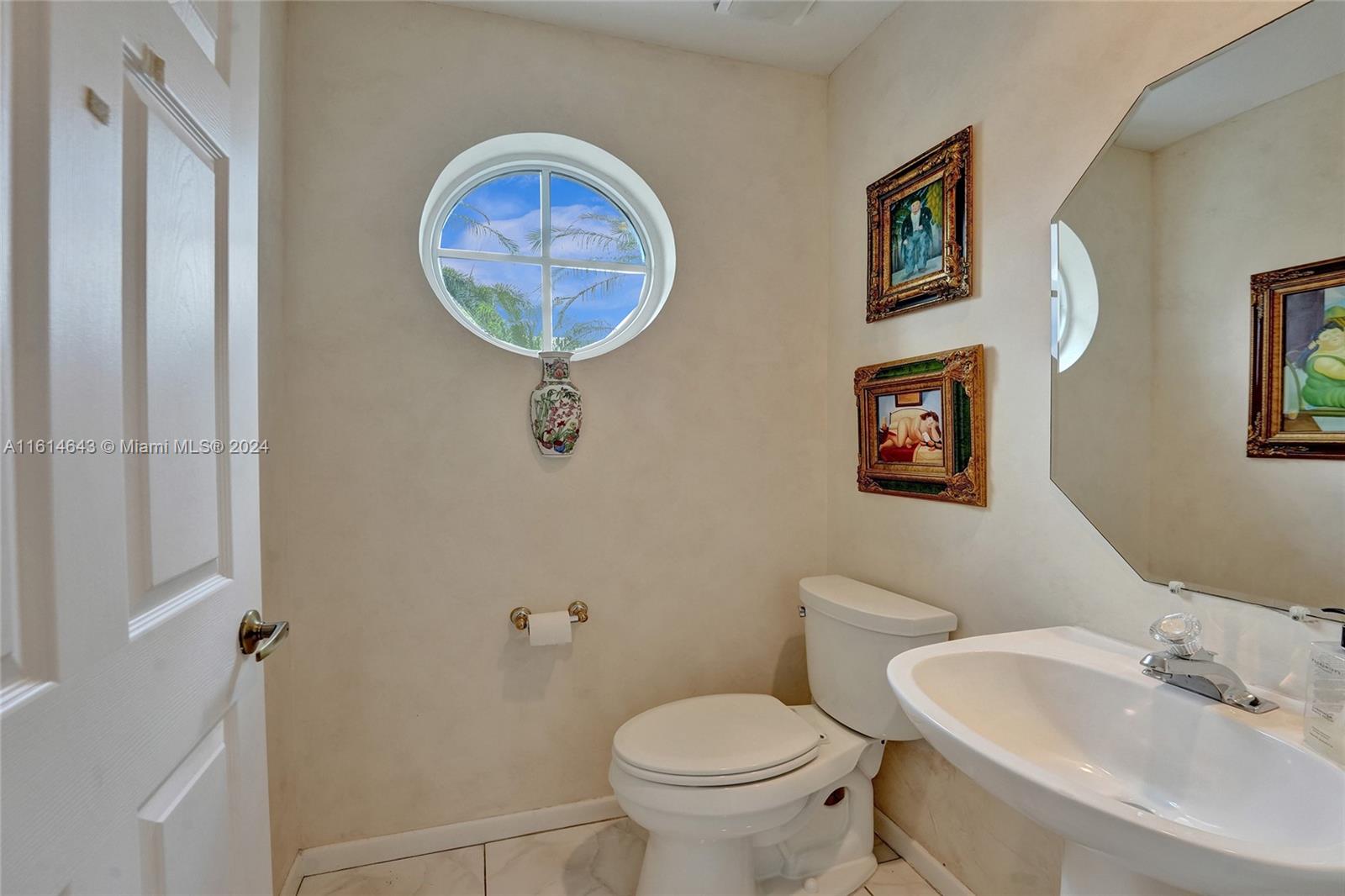 17269 Balboa Point Way Boca Raton, FL 33487 - Photo 13 of 41 a bathroom with a toilet a sink and a mirror