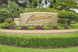 17269 Balboa Point Way Boca Raton, FL 33487 - Photo 2 of 41 a street sign on the side of a building
