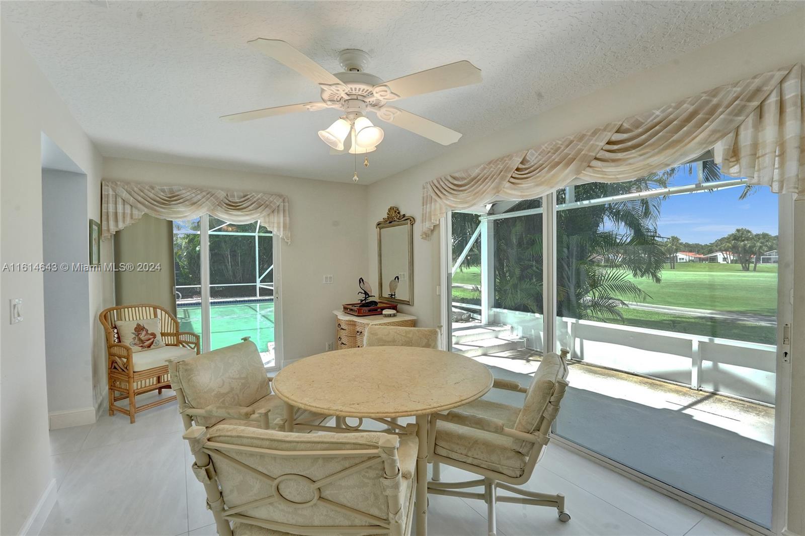 17269 Balboa Point Way Boca Raton, FL 33487 - Photo 23 of 41 a view of a dining room with furniture wooden floor and chandelier