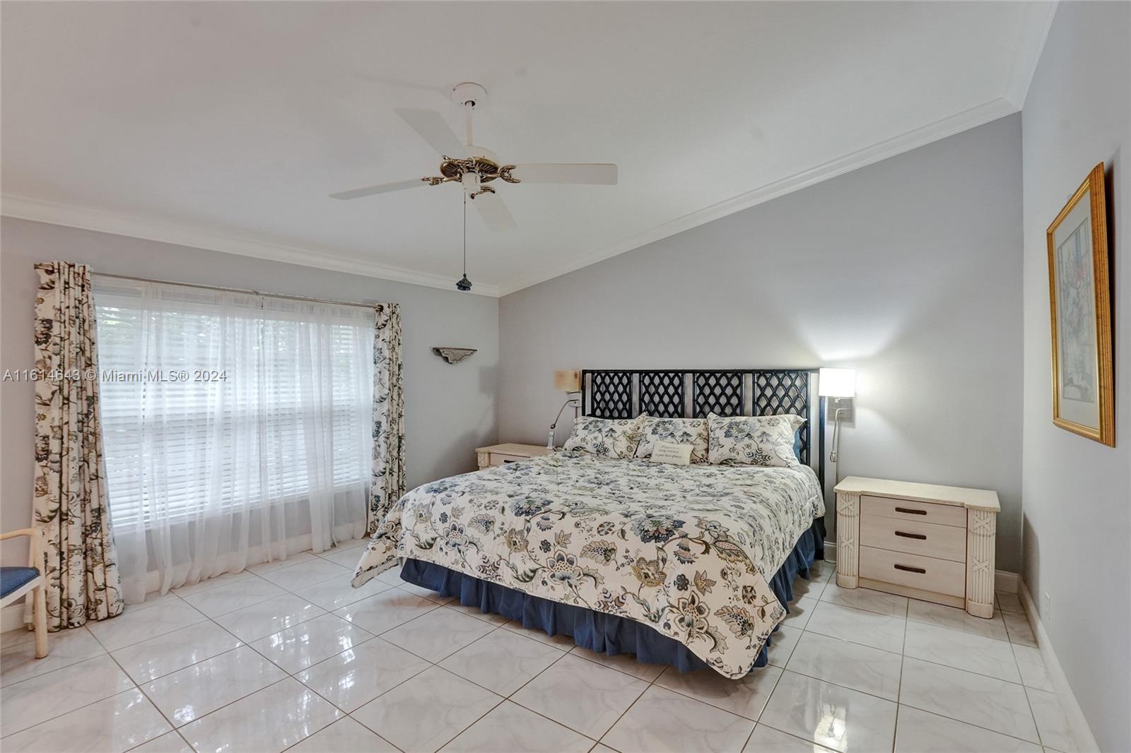 17269 Balboa Point Way Boca Raton, FL 33487 - Photo 24 of 41 a bedroom with a bed and window