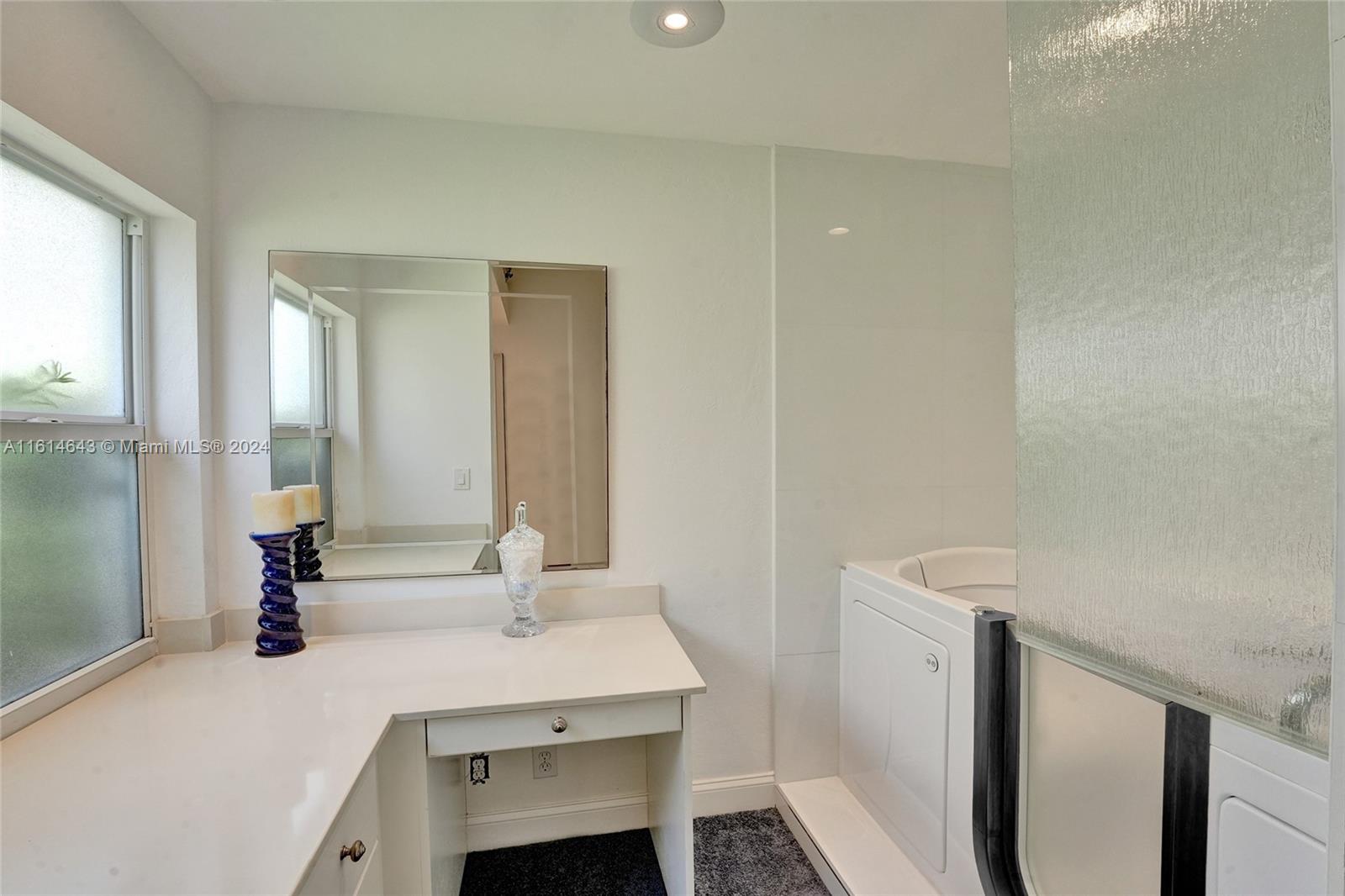 17269 Balboa Point Way Boca Raton, FL 33487 - Photo 26 of 41 a bathroom with a sink and a mirror