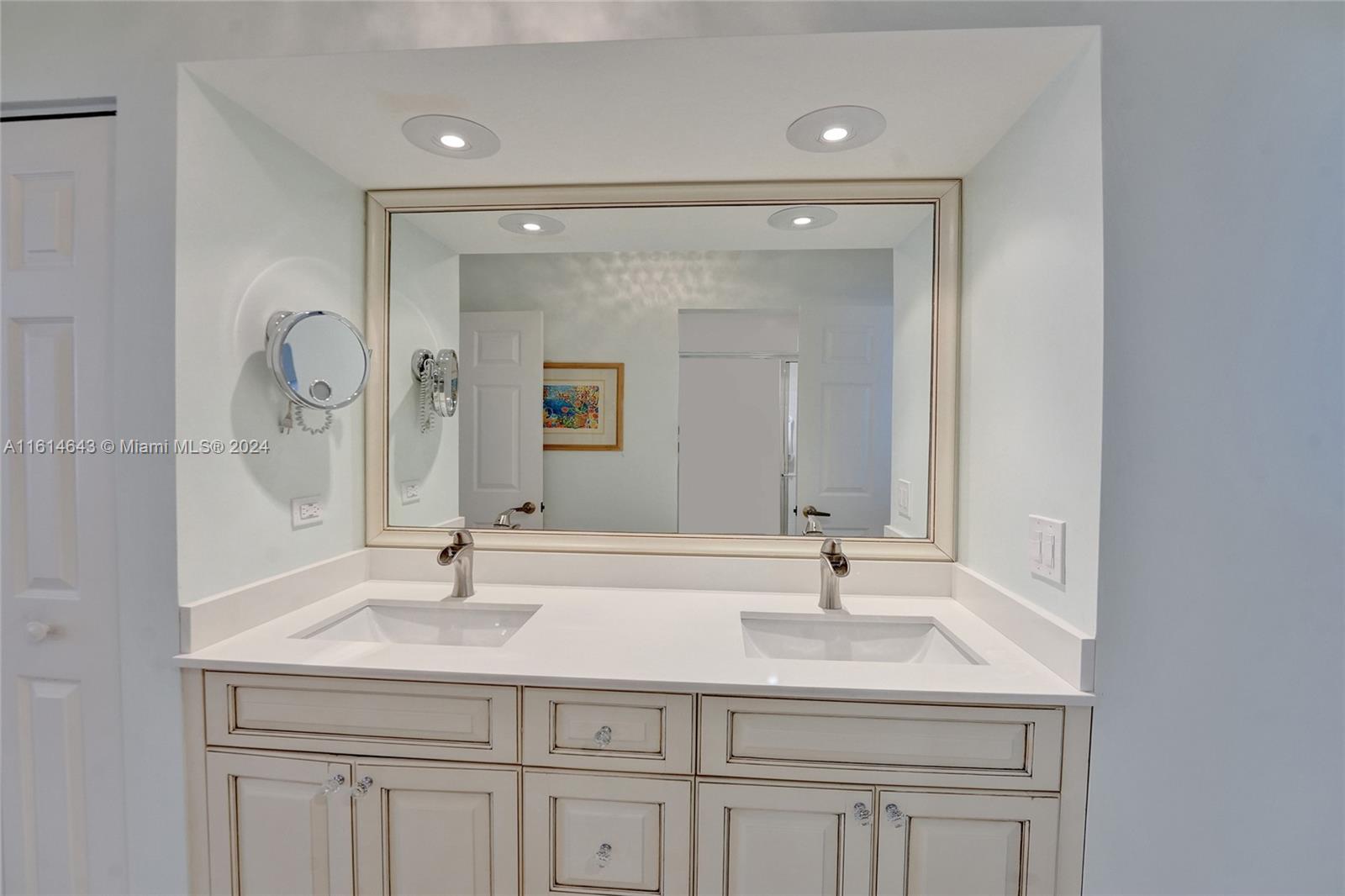 17269 Balboa Point Way Boca Raton, FL 33487 - Photo 30 of 41 a bathroom with a sink and a mirror