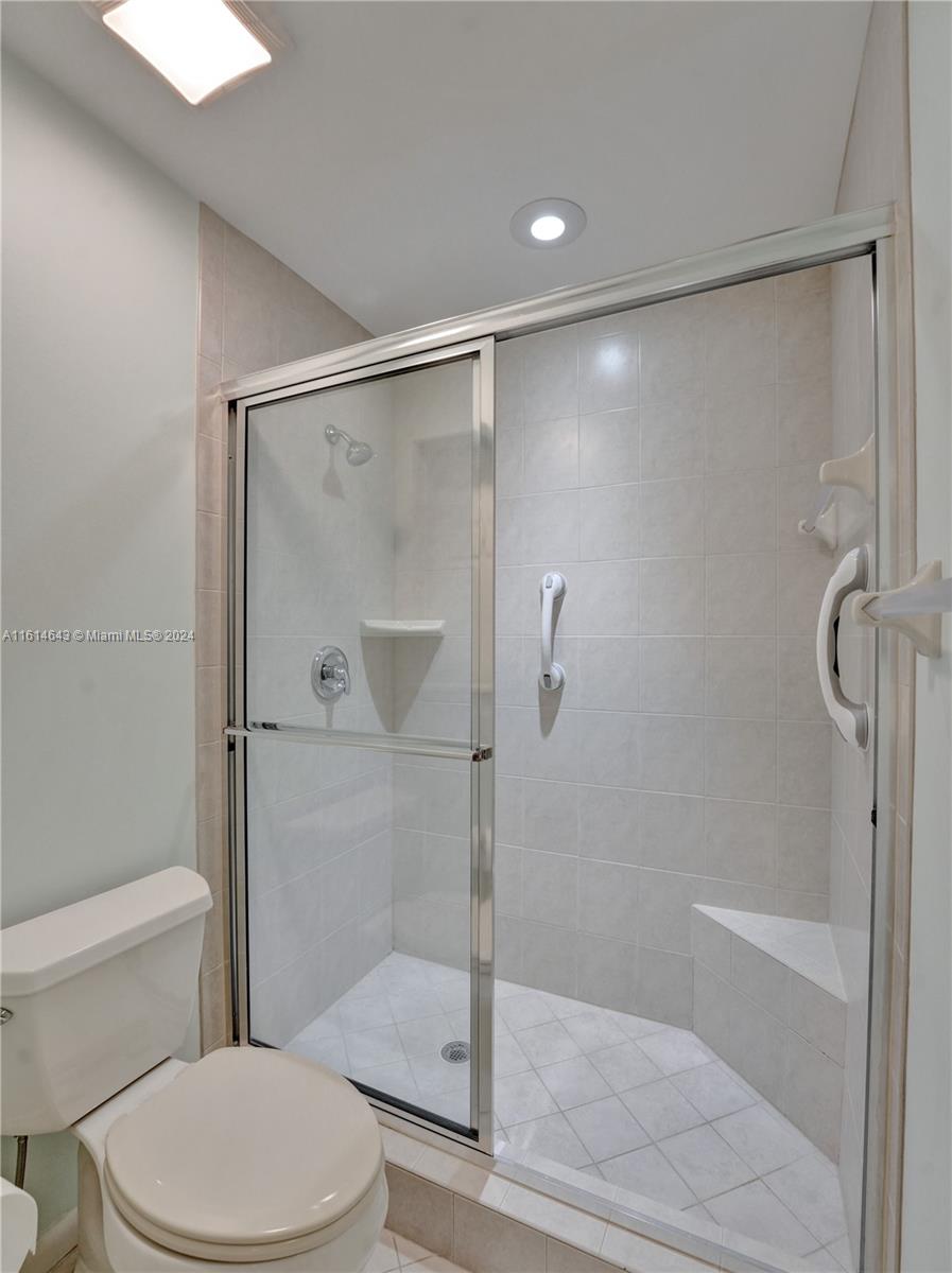 17269 Balboa Point Way Boca Raton, FL 33487 - Photo 31 of 41 a bathroom with a shower a toilet and a shower