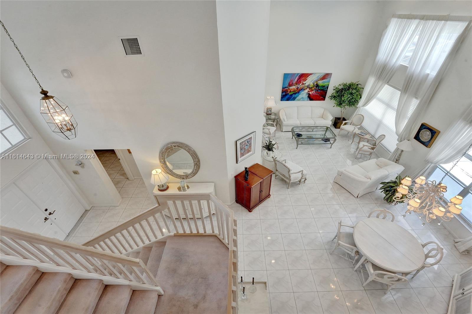 17269 Balboa Point Way Boca Raton, FL 33487 - Photo 34 of 41 a living room with furniture and a fireplace