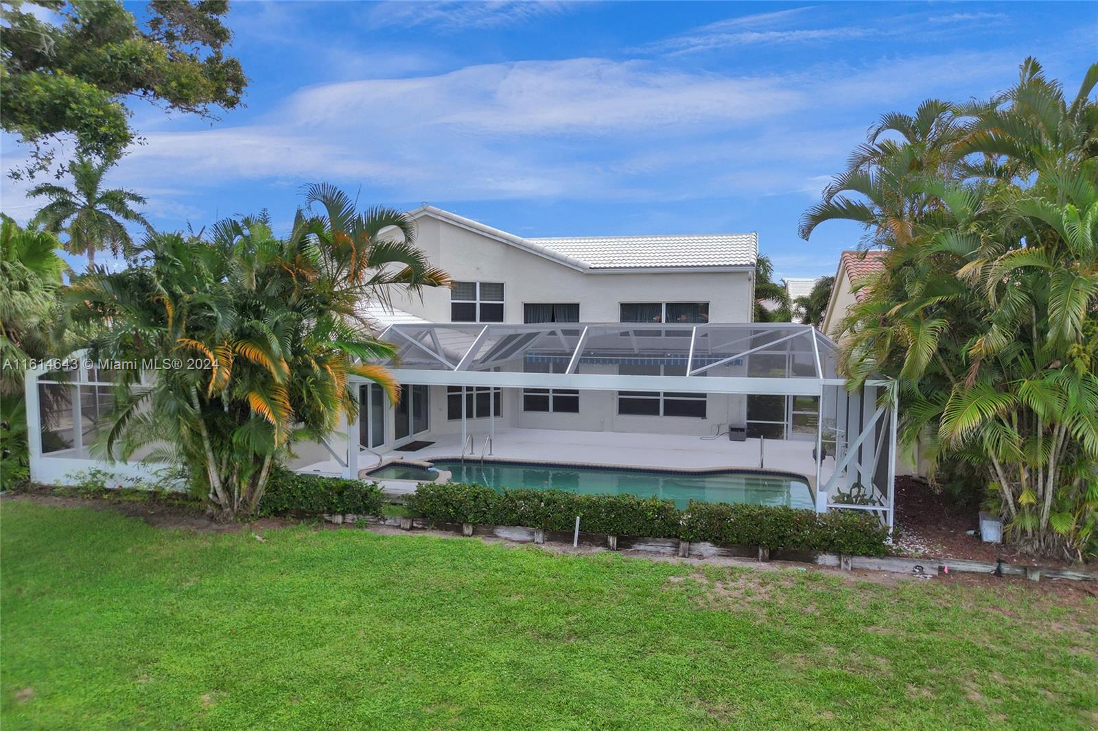 17269 Balboa Point Way Boca Raton, FL 33487 - Photo 35 of 41 a front view of a house with a garden