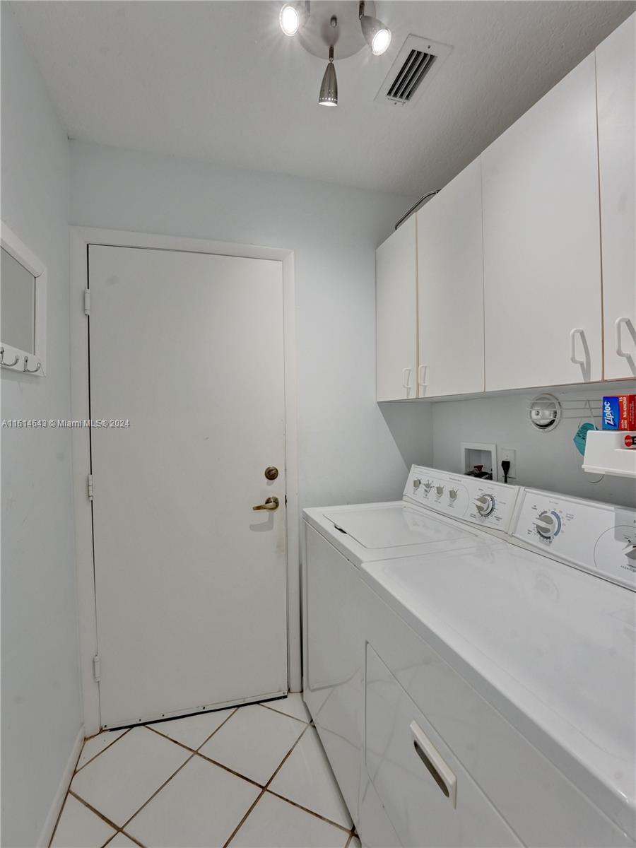17269 Balboa Point Way Boca Raton, FL 33487 - Photo 41 of 41 a utility room with dryer and washer