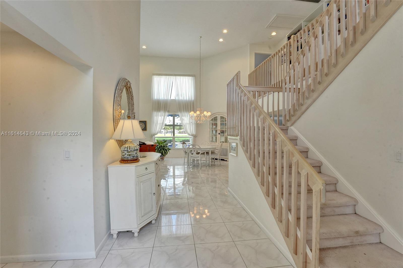 17269 Balboa Point Way Boca Raton, FL 33487 - Photo 6 of 41 a view of entryway and hall with wooden floor