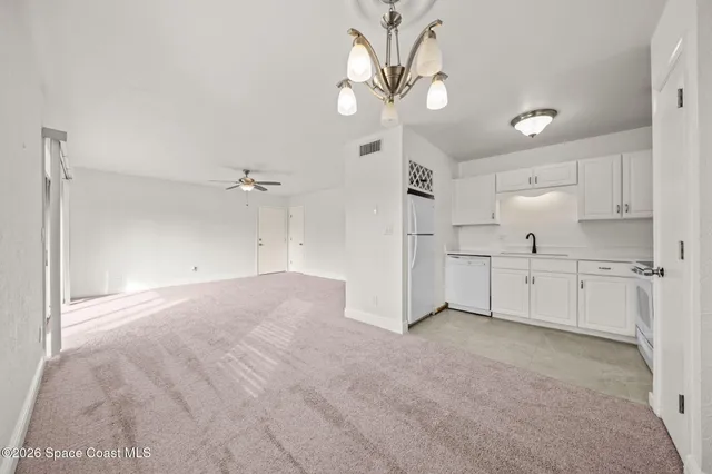 a view of a kitchen with a sink