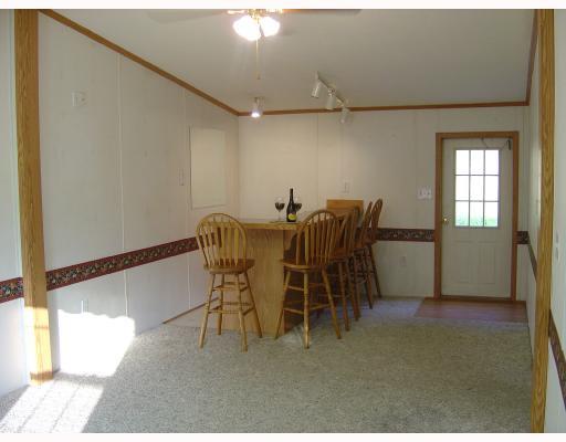 Exterior Front. family room with custom built in book cases and pellet stove