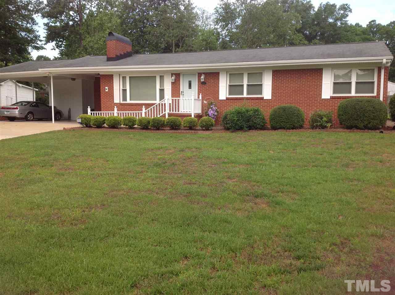 145 Creech Road Garner, NC 27529 - Photo 1 of 15 a front view of house with yard and green space