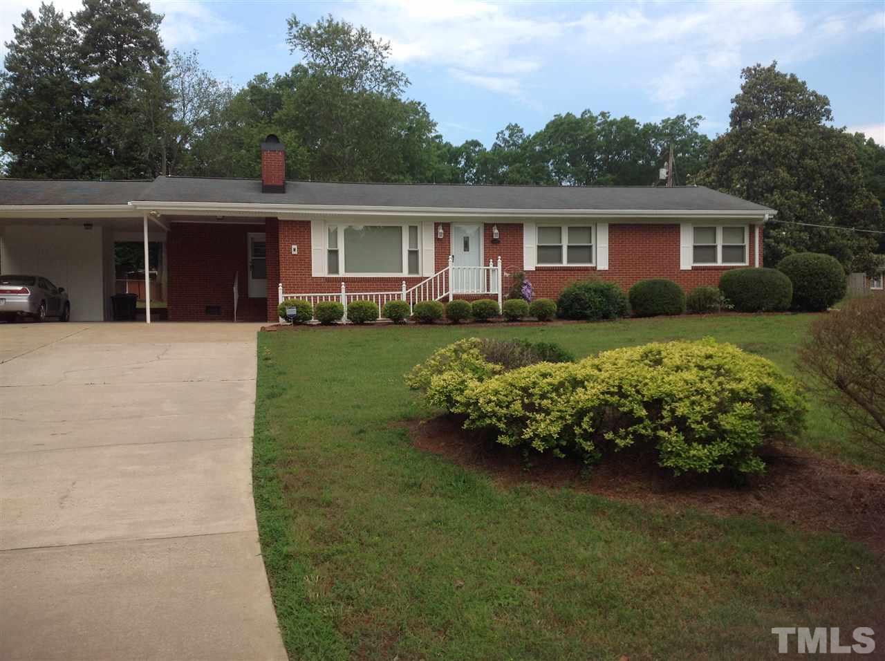 145 Creech Road Garner, NC 27529 - Photo 2 of 15 a front view of a house with a garden