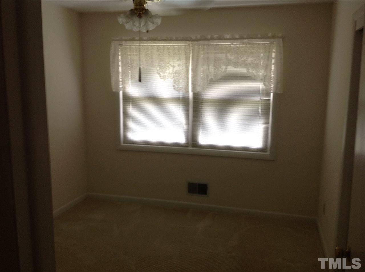 145 Creech Road Garner, NC 27529 - Photo 11 of 15 a bathroom with a window