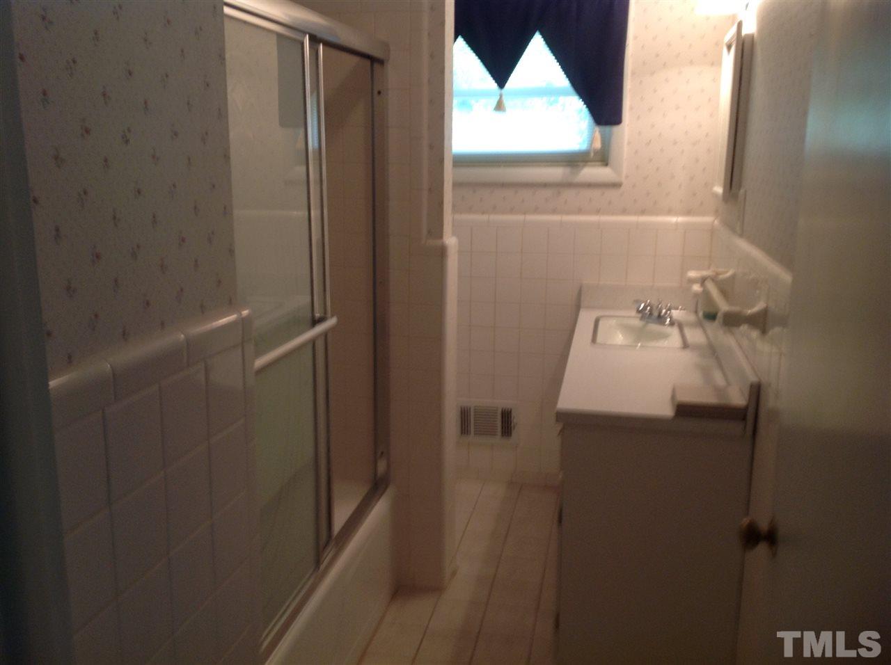 145 Creech Road Garner, NC 27529 - Photo 12 of 15 a bathroom with a sink