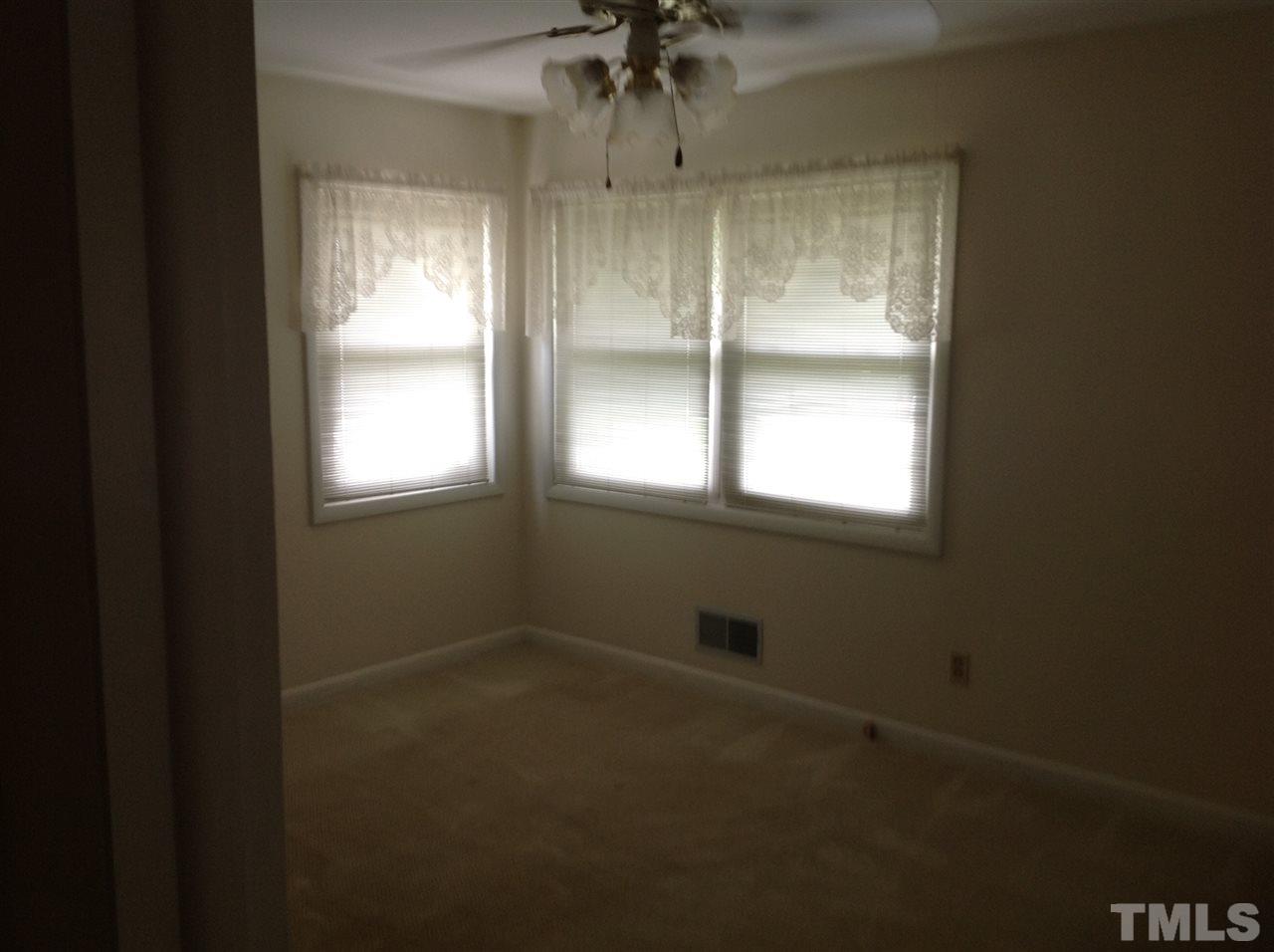 145 Creech Road Garner, NC 27529 - Photo 14 of 15 a view of an empty room with a window
